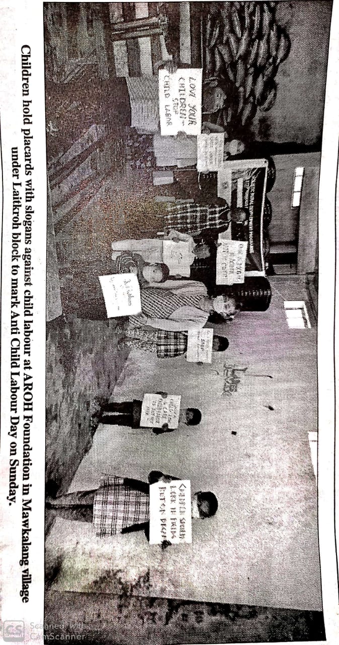 Children hold placards with slogans against child labour at AROH Foundation in Mawkalang village under Laitkroh block to mark Anti-Child Labour Day on Sunday